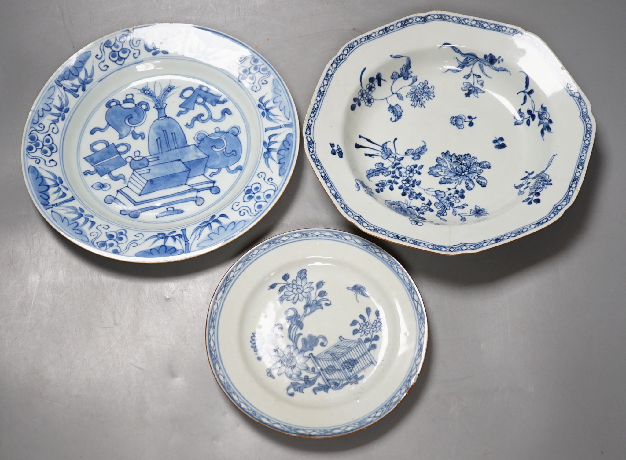 A Set of six 18th century Chinese export blue and white ‘bird in a cage’ small plates, 6.3 cm diameter and two pairs of 18th century Chinese export blue and white plates dishes, largest 23cm diam (10)